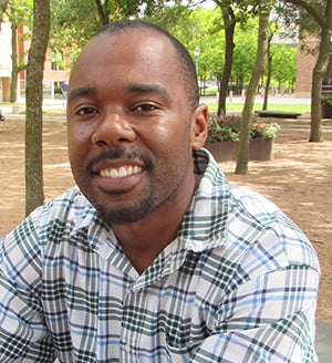 Portrait of man in green and blue checked shirt