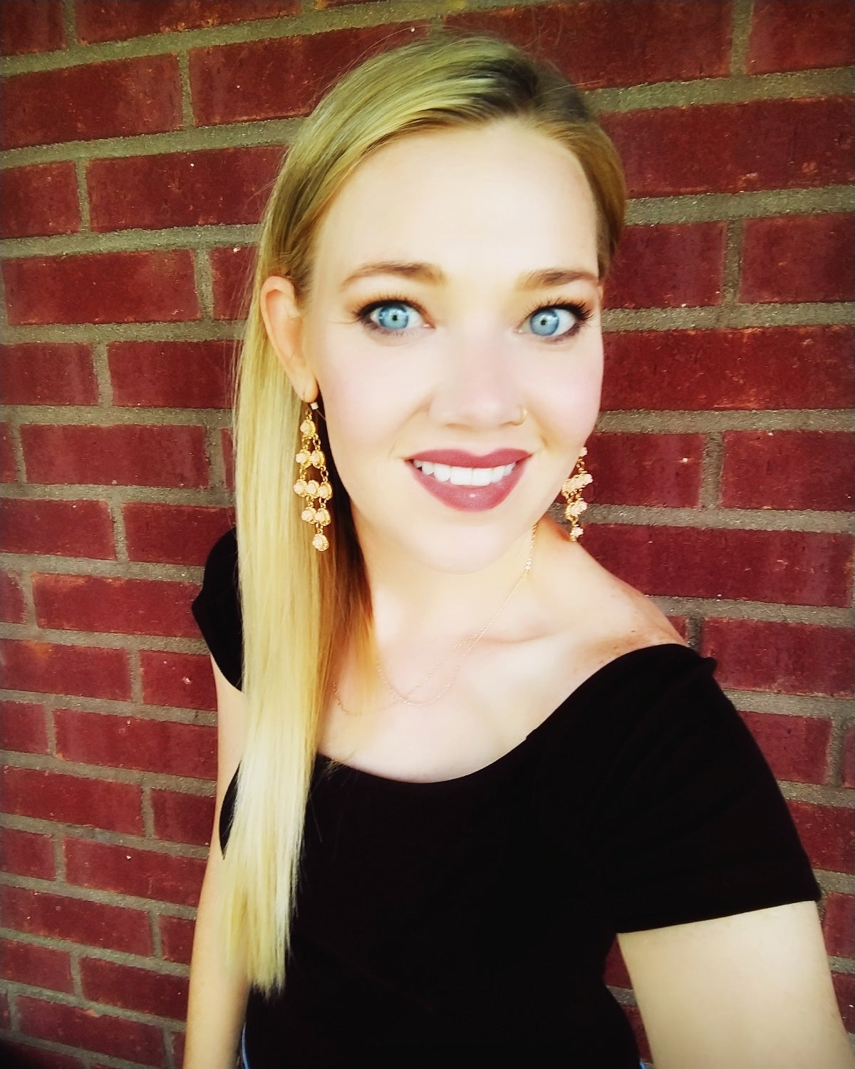 Woman in black shirt with blue eyes