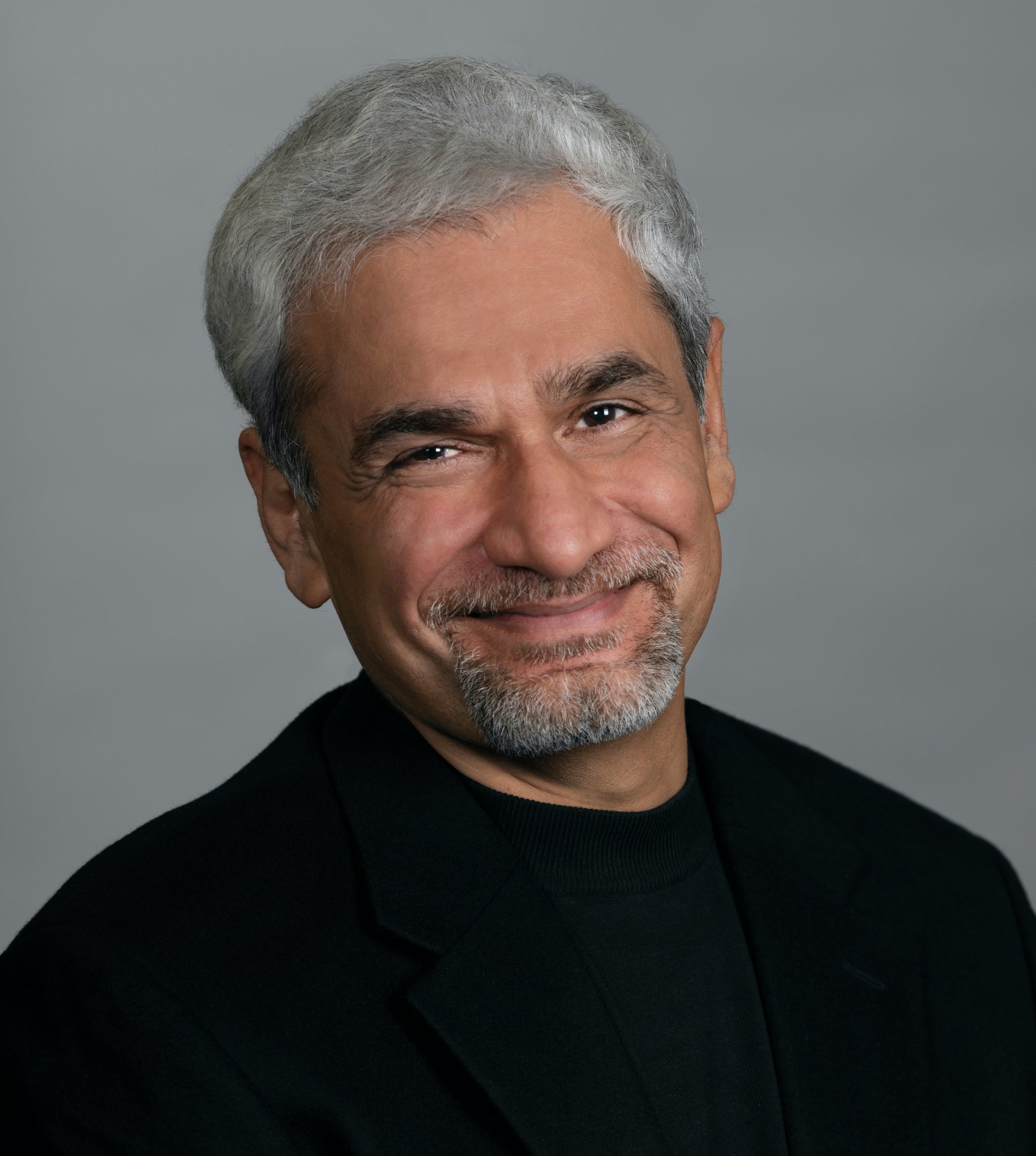 Man with gray hair and black shirt