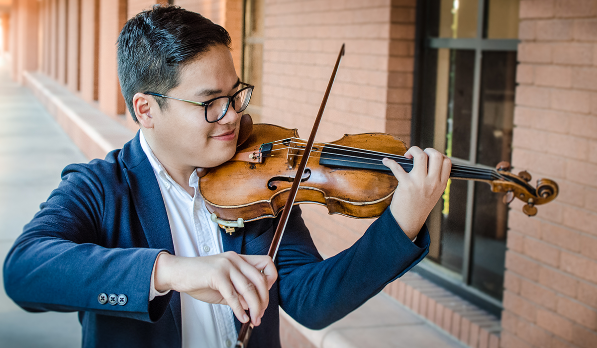 student playing the violin