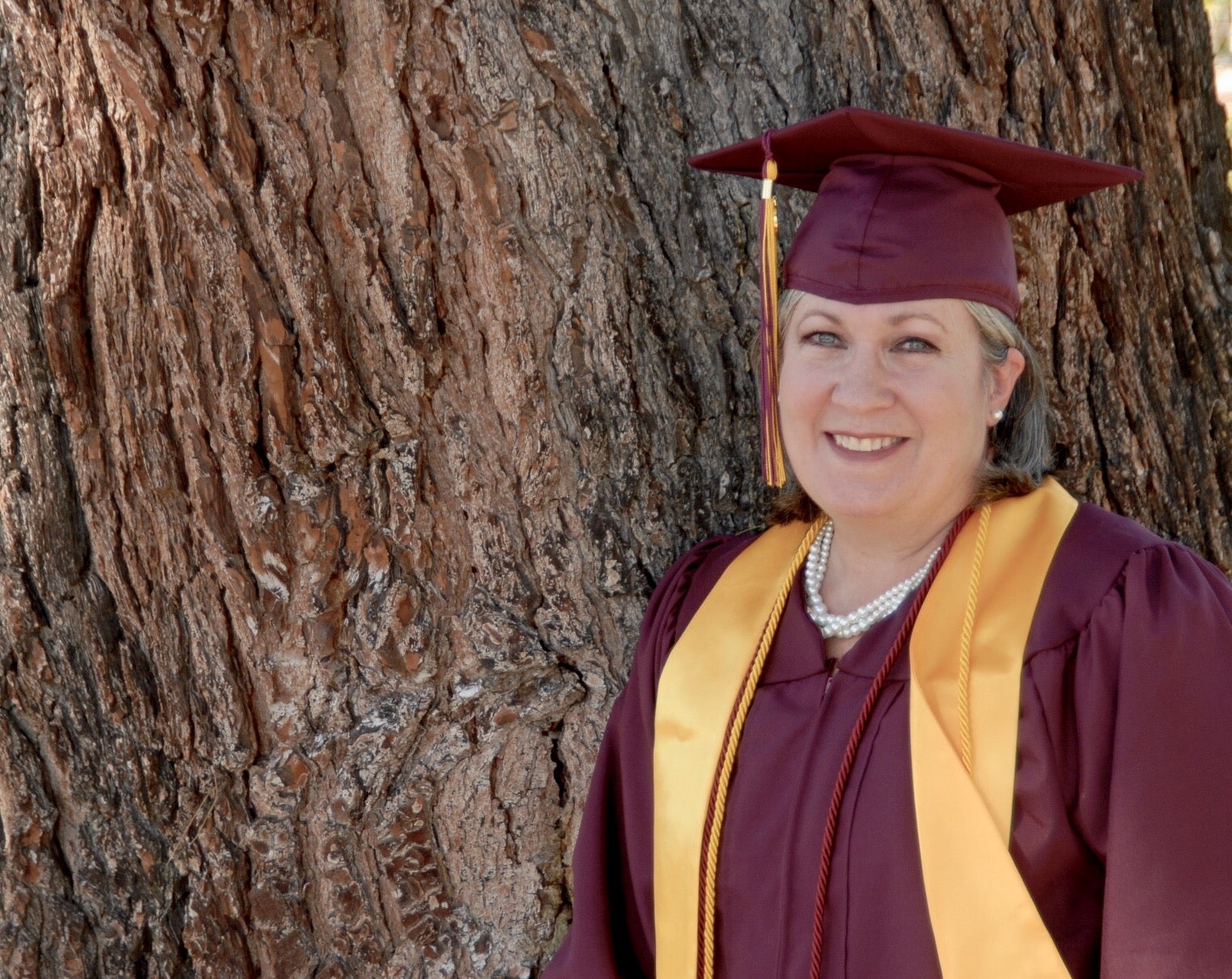 portrait of student in cap and gown