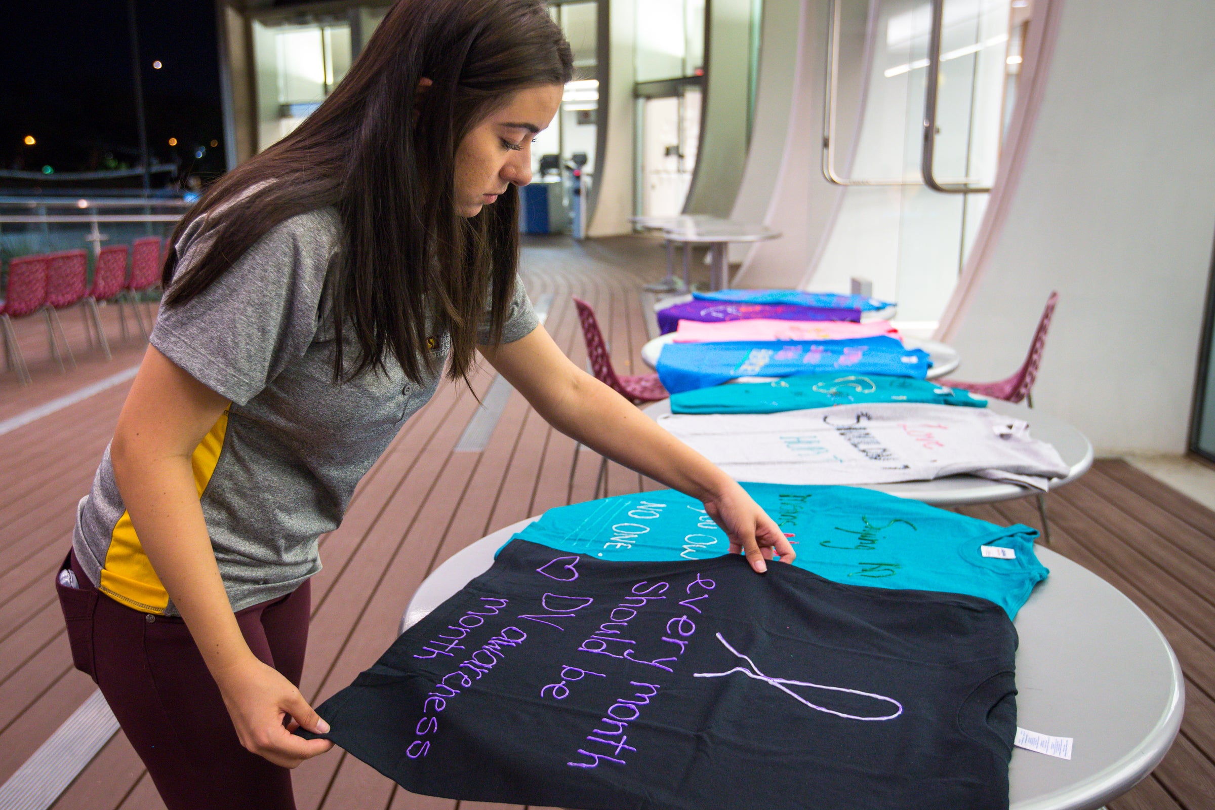 girl laying T-shirt out to dry