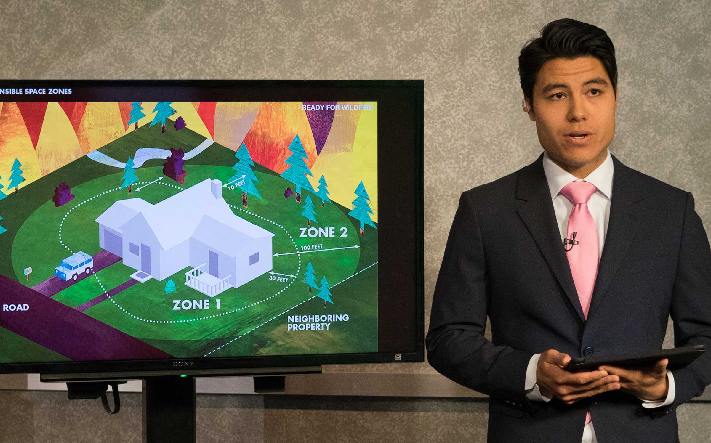 Anchor Bayan Wong practices his rundown on Arizona wildfire season in the Cronkite News newsroom