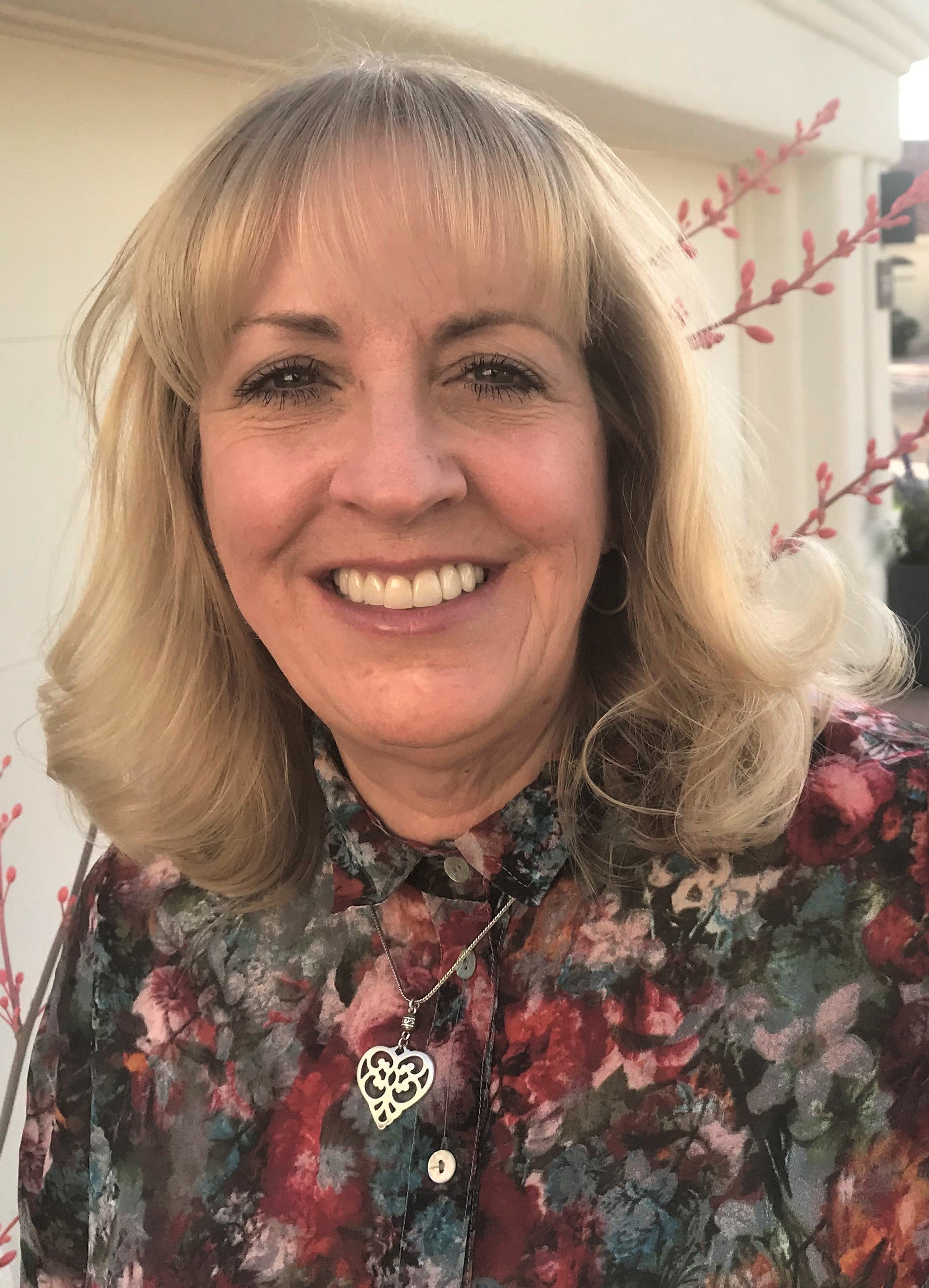 Woman with broach smiling