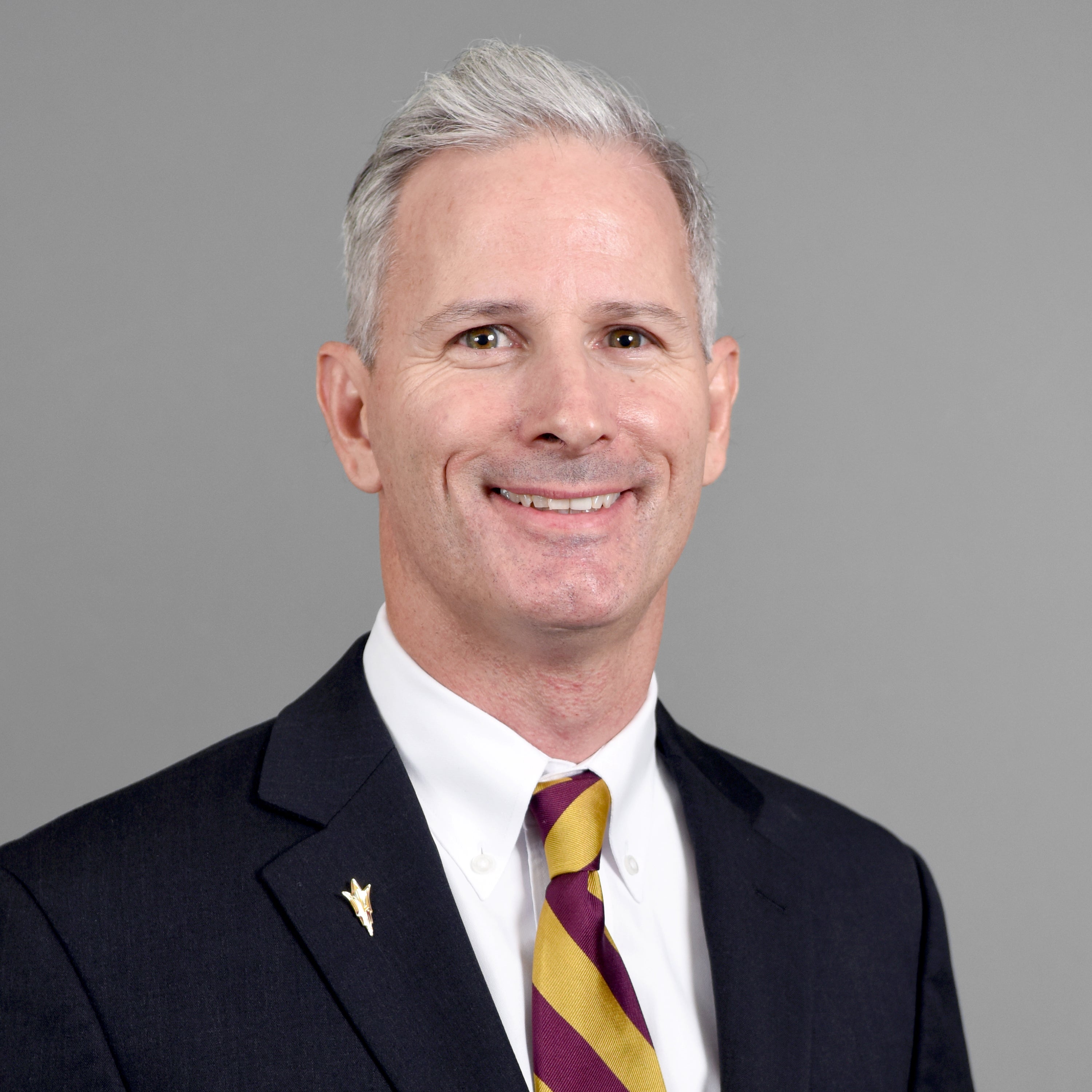 Man with grey hair smiling