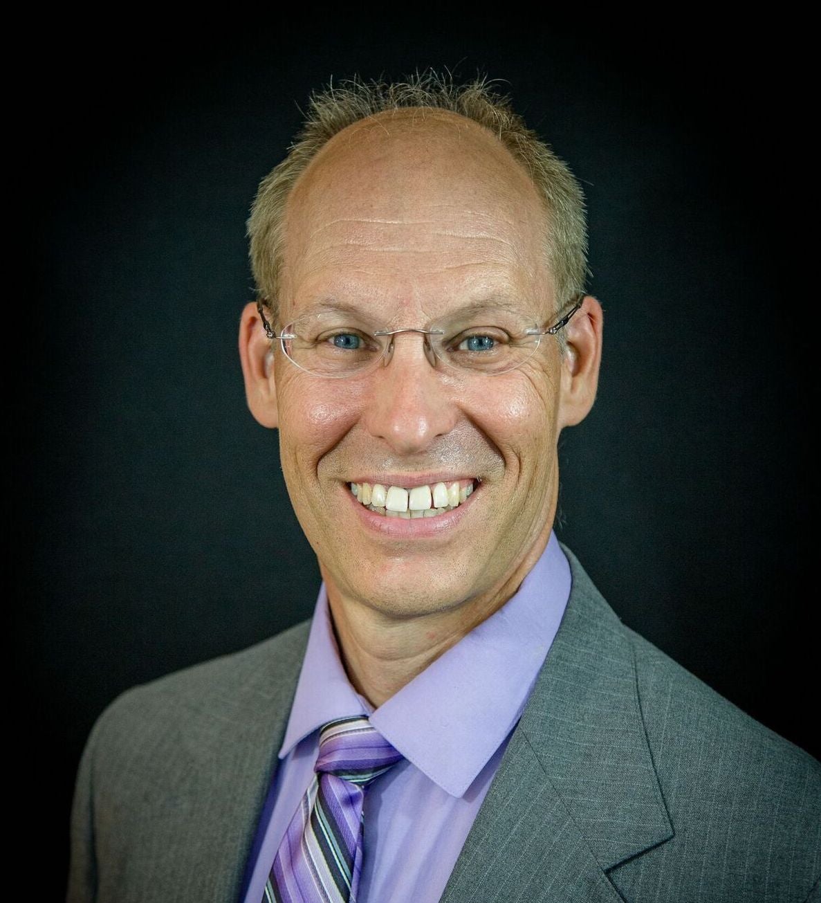 Man in glasses, suit and tie