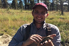 man holding lizard