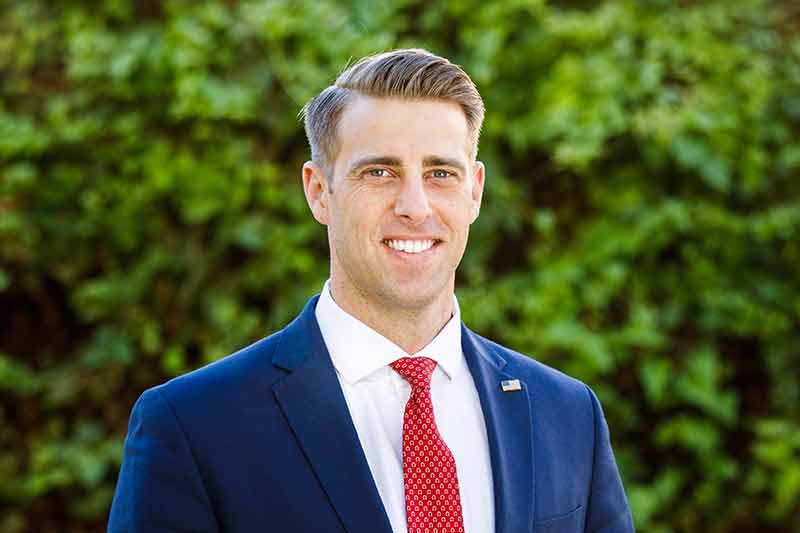 Young man in red tie and blue jacket