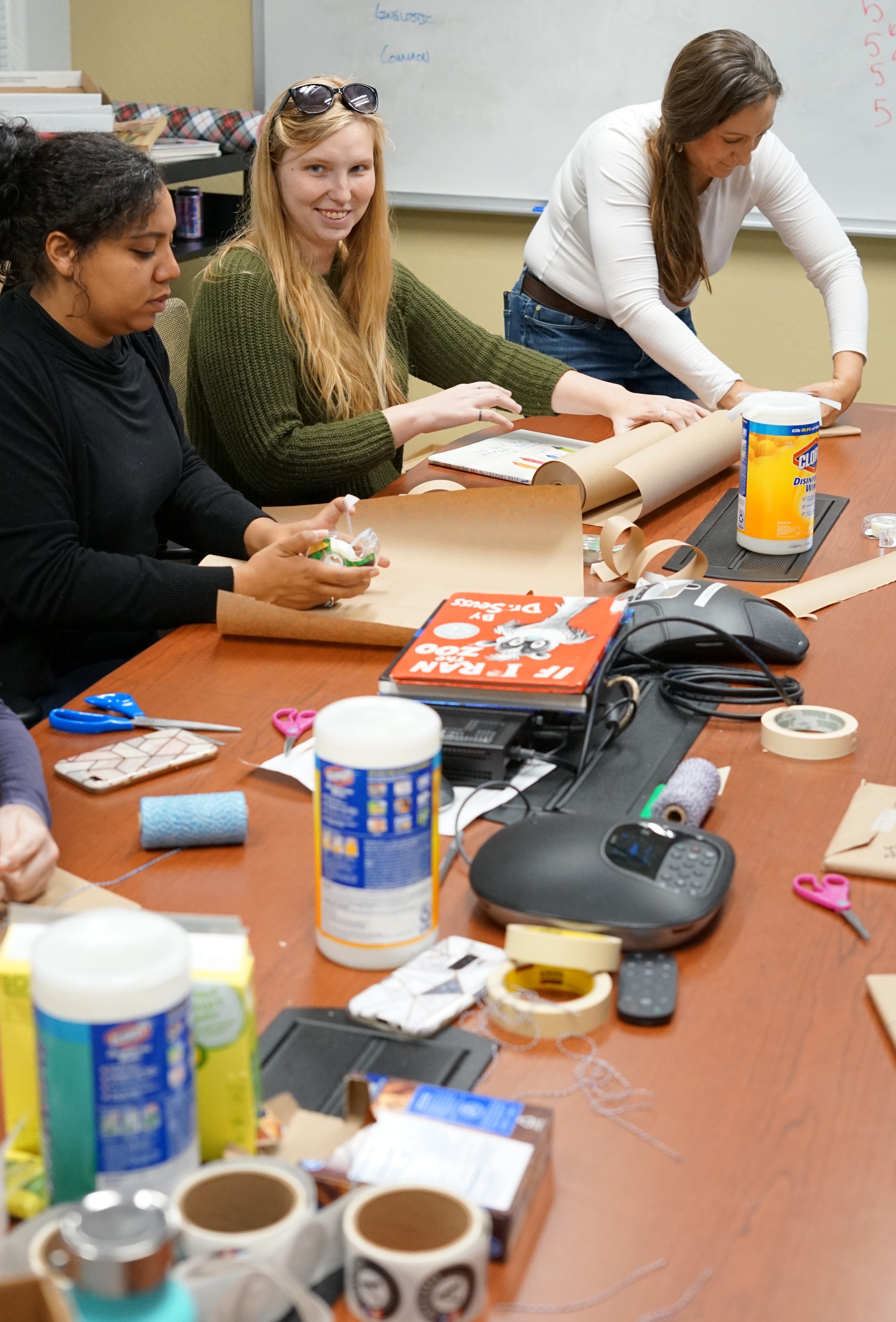 School of Social Work students clean and wrap some of nearly 1,000 children's books they collected for distribution at Phoenix-area domestic-violence shelters Jan. 20 as part of the 25th MLK Day of Service