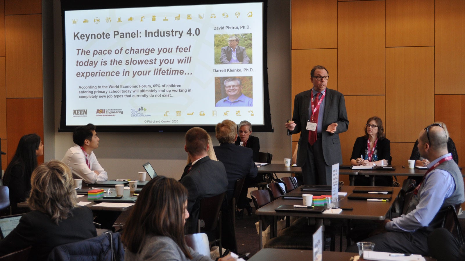 A speaker addresses a gathering of industry professionals and ASU co-curricular program leaders.