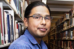 man's portrait in library