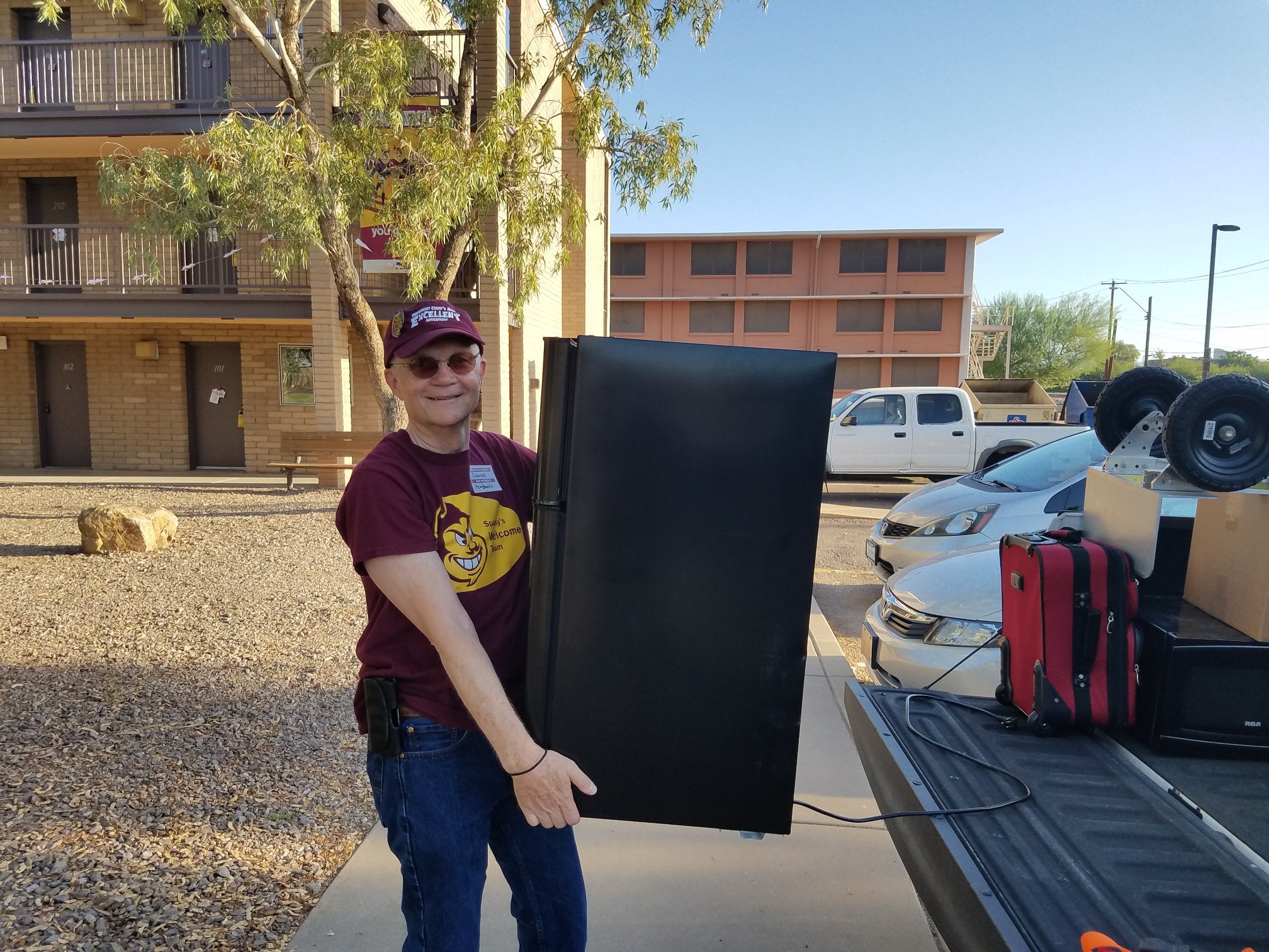 Duane carries refrigerator