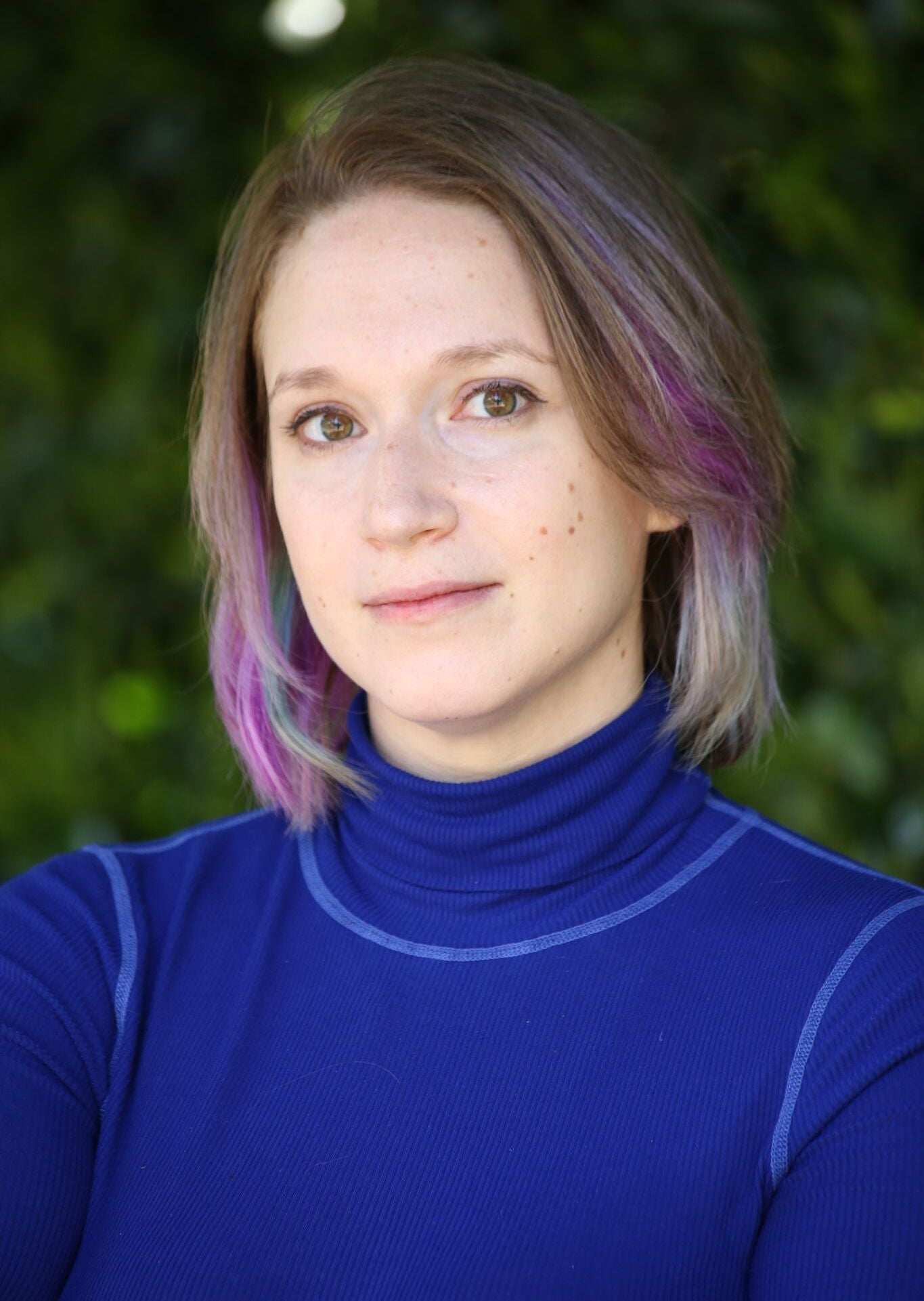 Woman in blue turtleneck