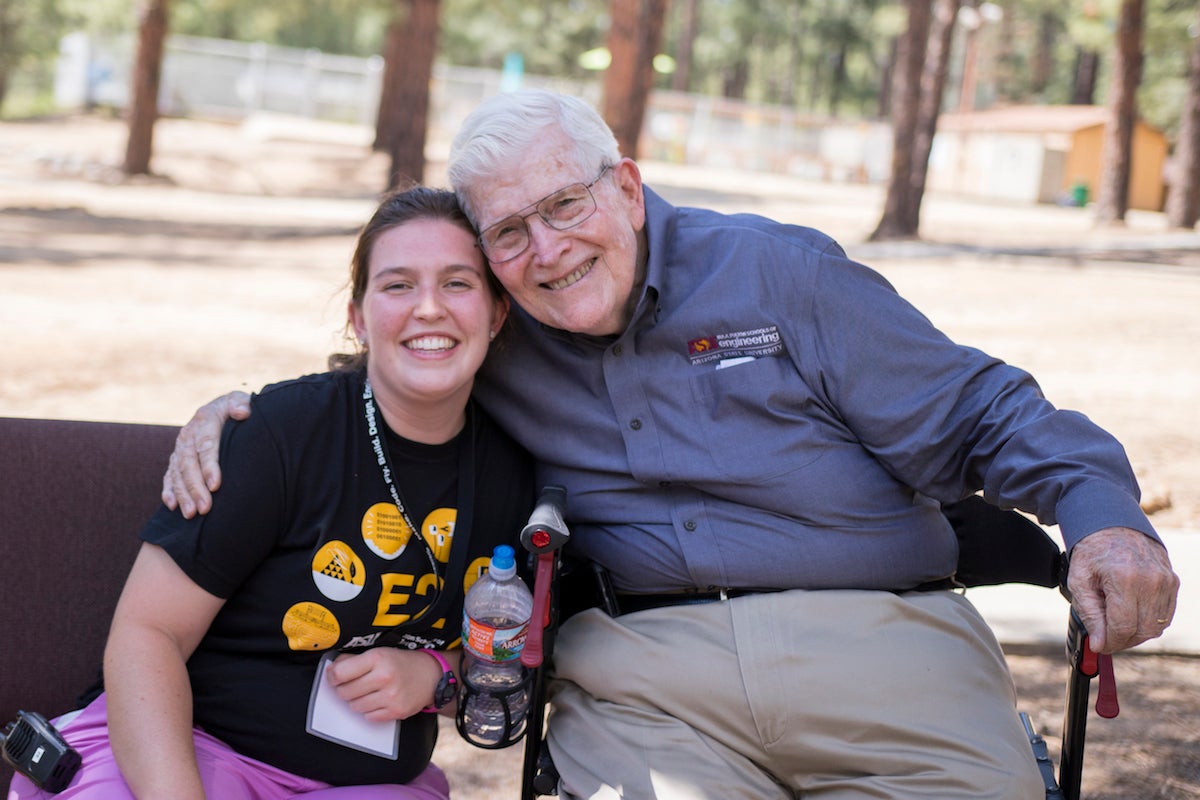 two people hugging at event last year