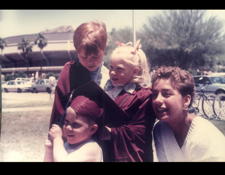 Vintage photo of young girl wearing her aunt's graduation cap