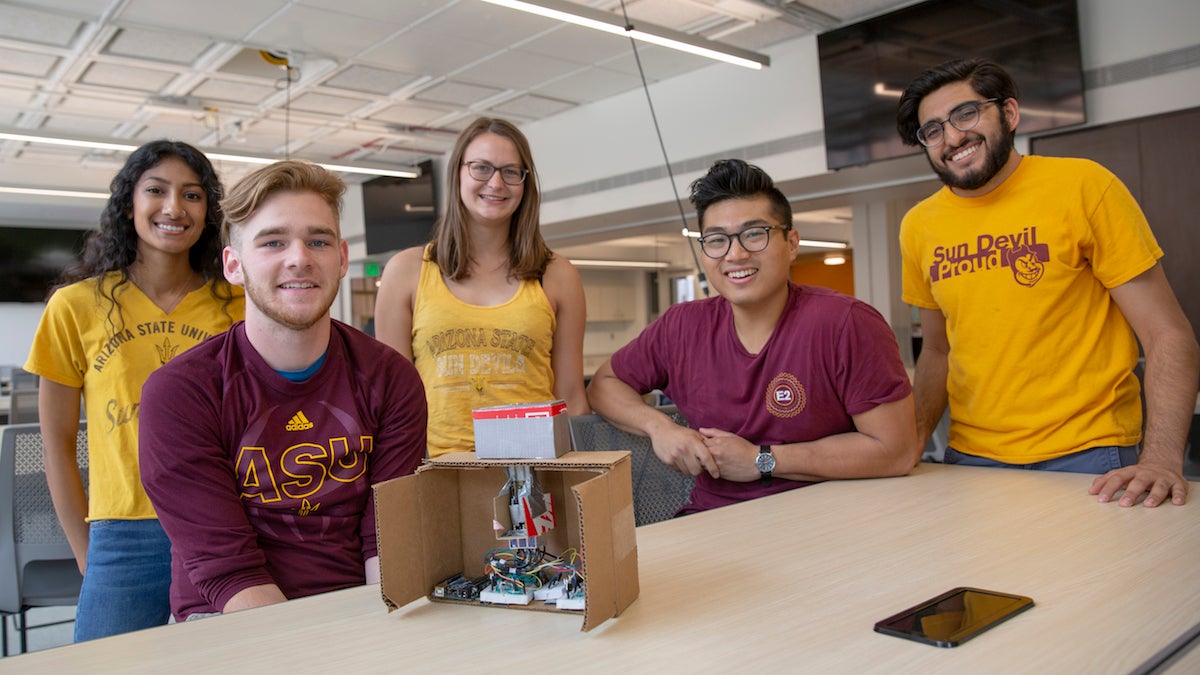 group of students sitting around desk