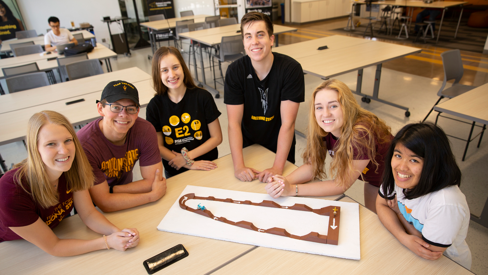 group of people sitting around a desk