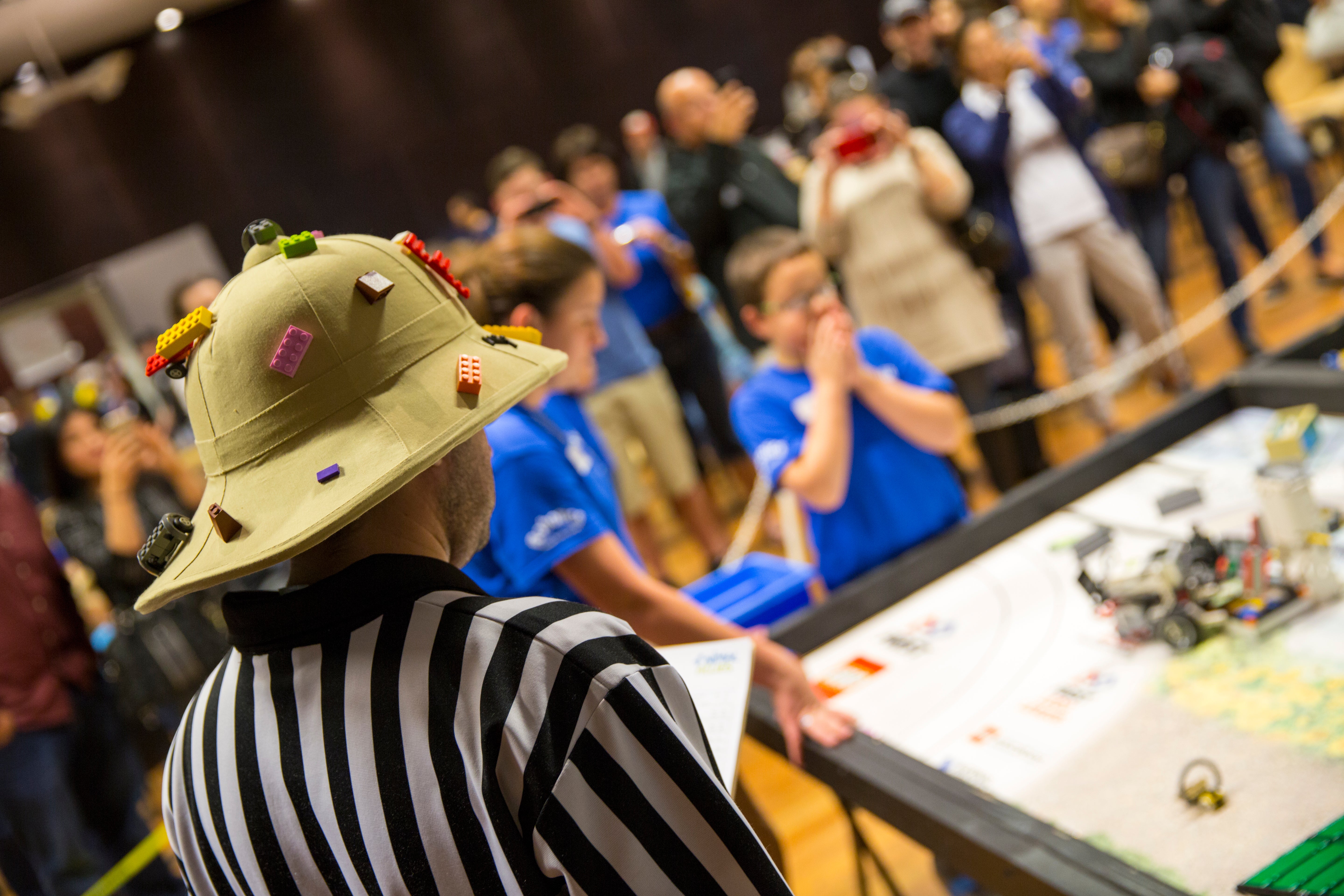 judge watching Lego competiton