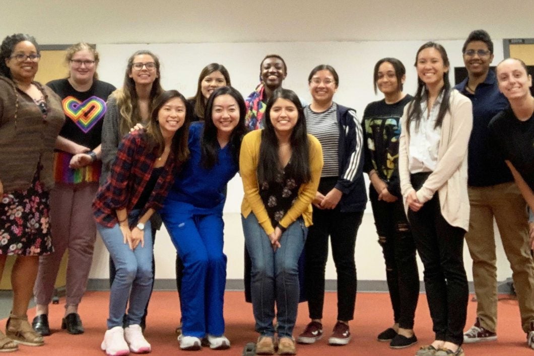 ASU students and their faculty adviser posing for a group photo