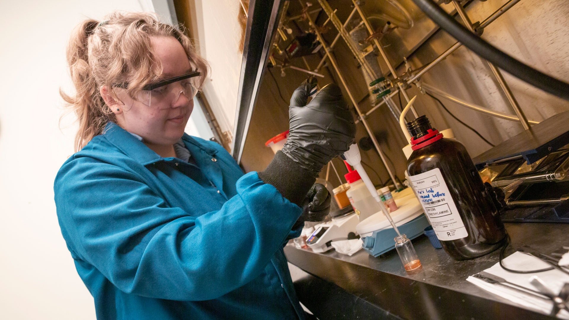 Chemical engineering student Micayla Corker works with equipment in a lab as part of the FURI program at the Ira A. Fulton Schools of Engineering at ASU.