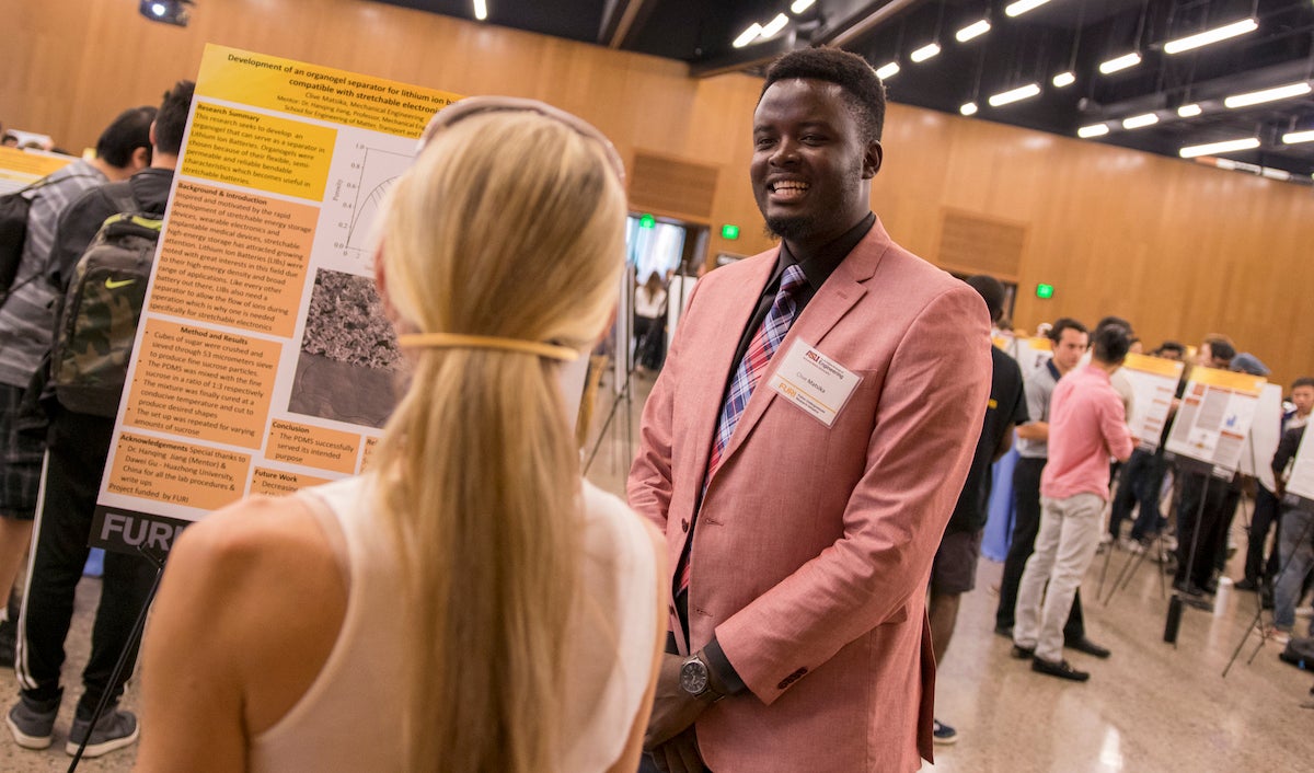 two people talking at poster session