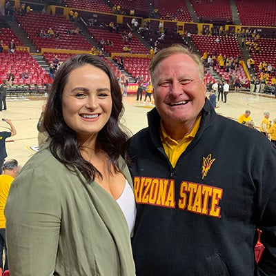 two people posing at ASU basketball game