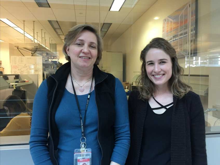 Research mentor Debbie Hansen and Karie Behm pose for a photo