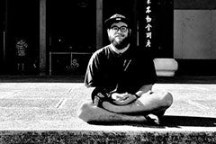 man posing at Buddhist monastery 