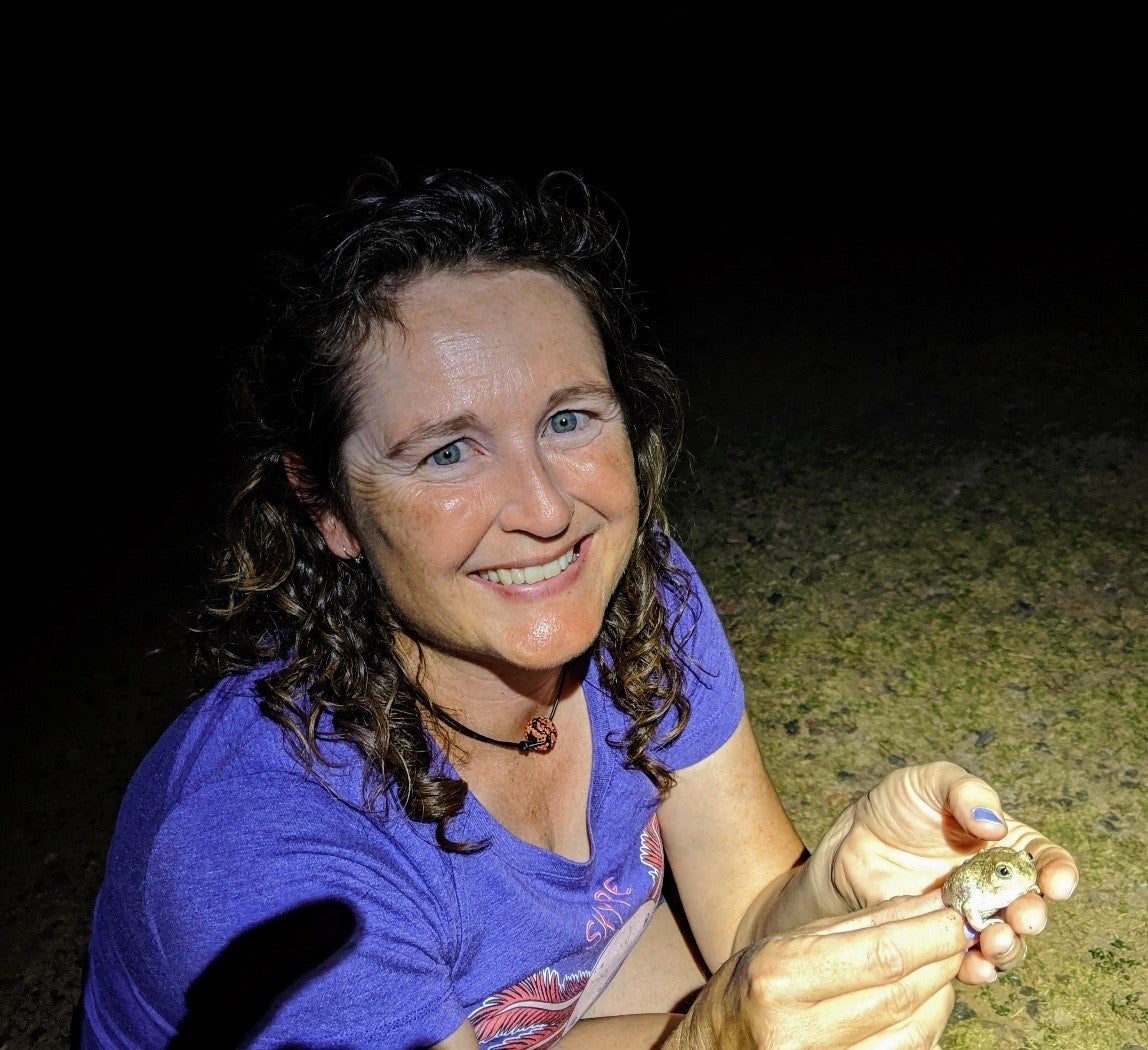 Woman holding a frog