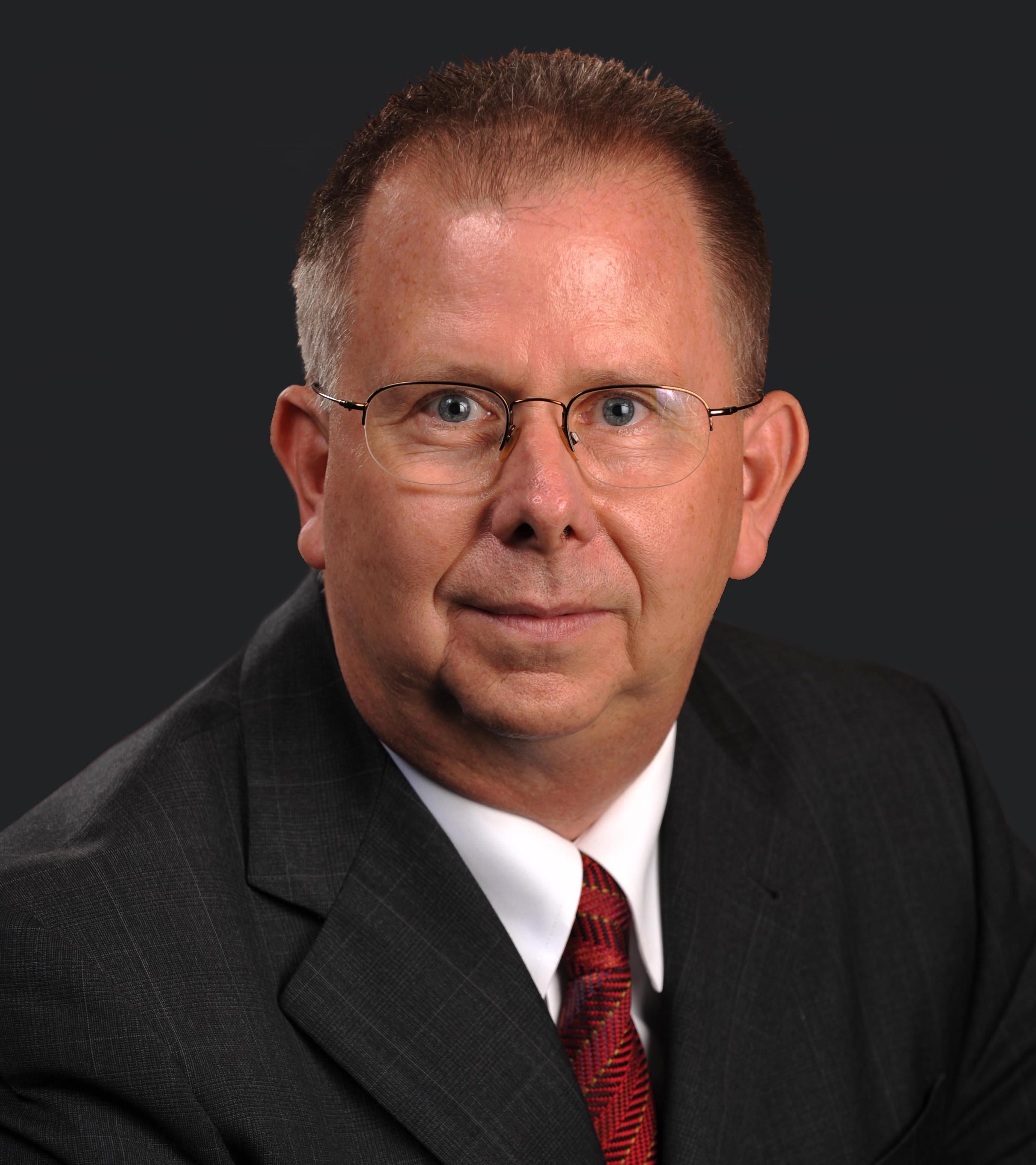 Man in glasses and shirt and tie