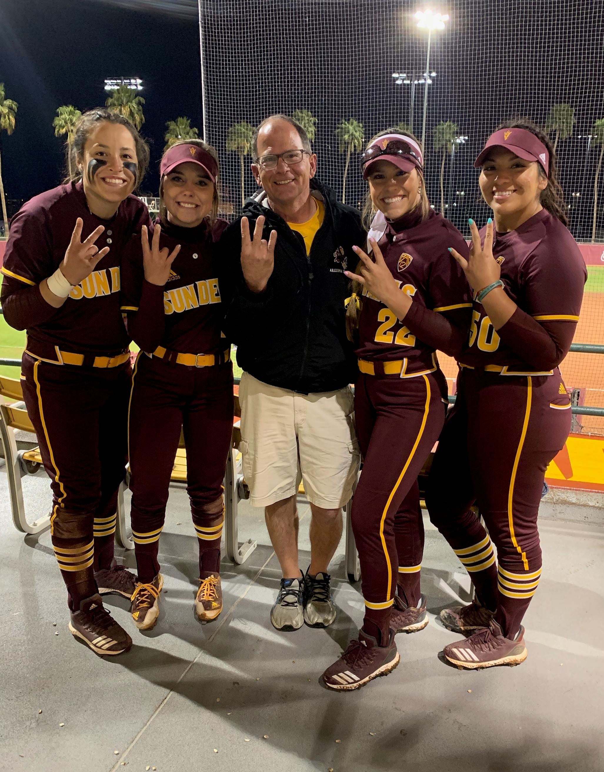 Frank Mayer with the lady Sun Devil softball team