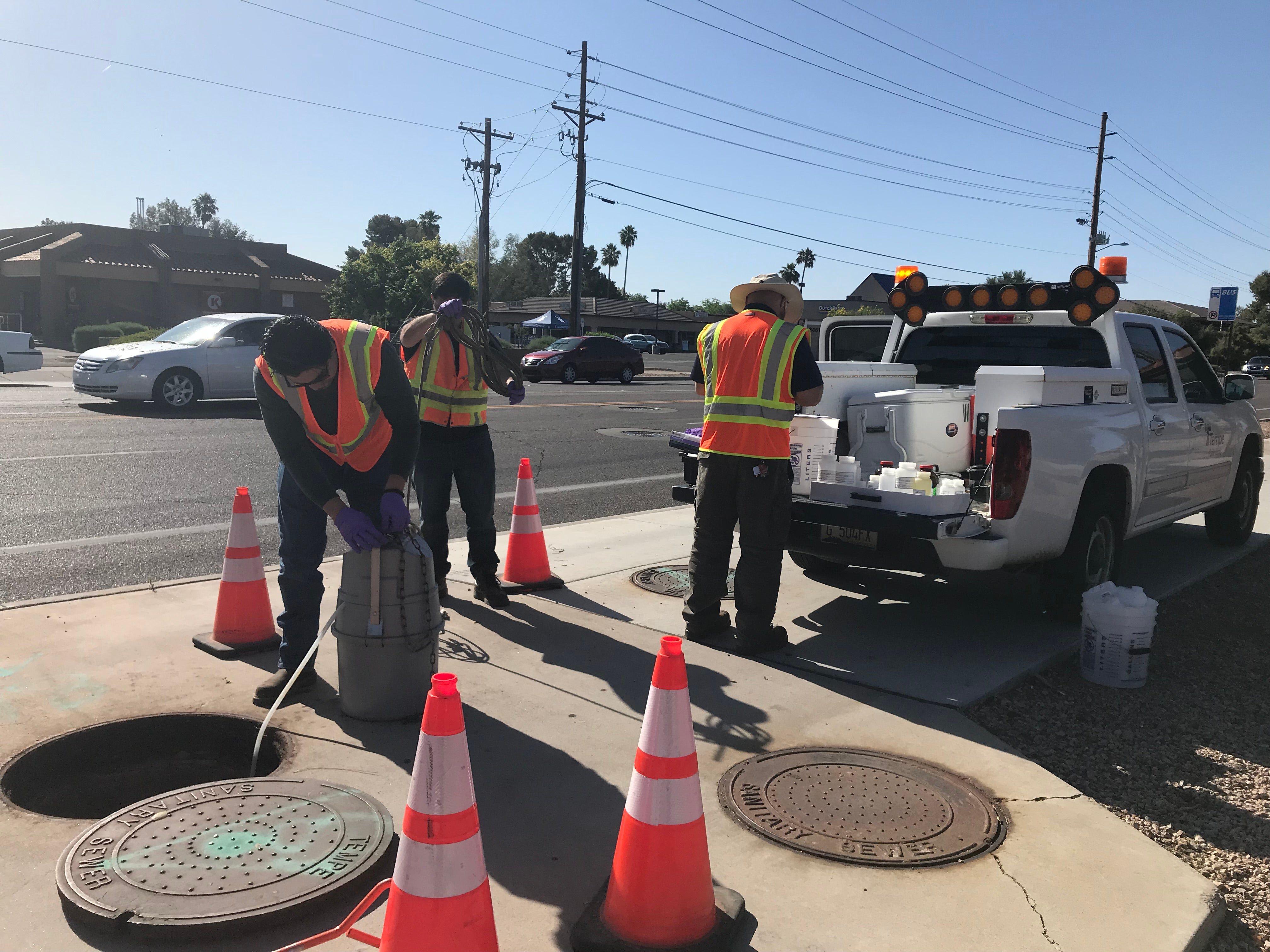 Tempe public service workers collect wastewater samples 