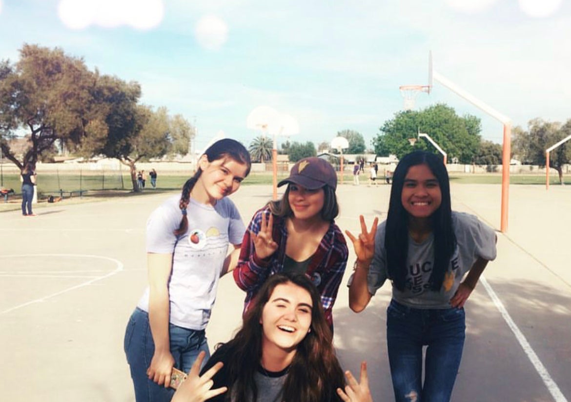 Group photo of ASU student mentors on the playground at a Tempe middle school