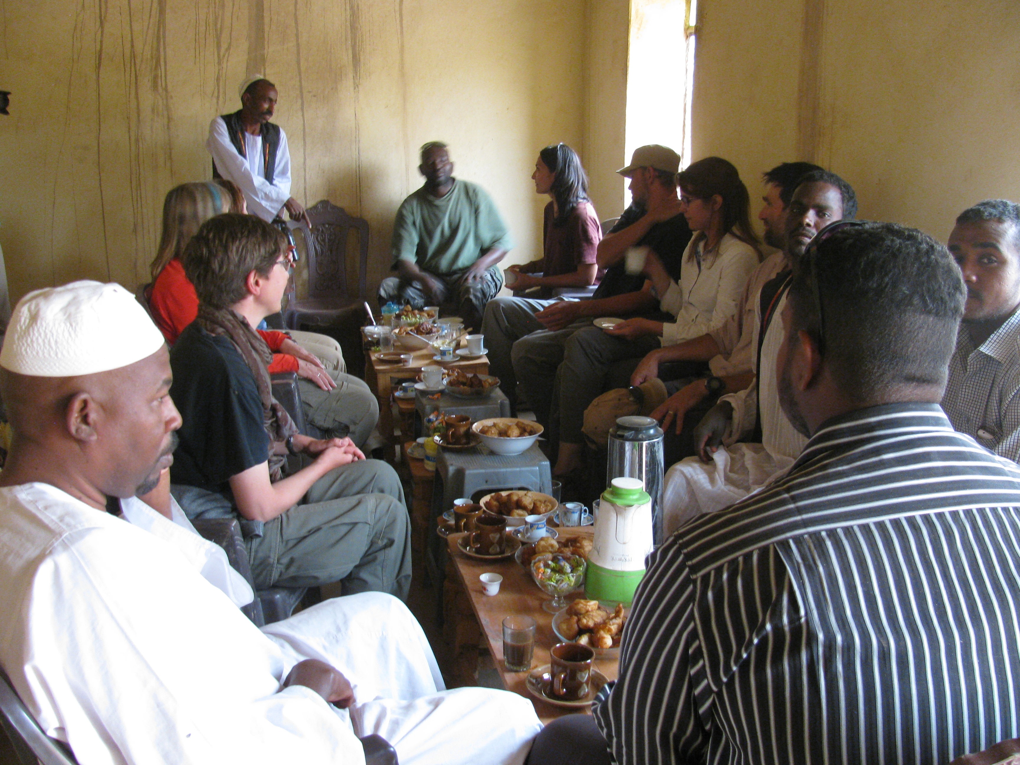 photo of Baker having tea at a workman’s house