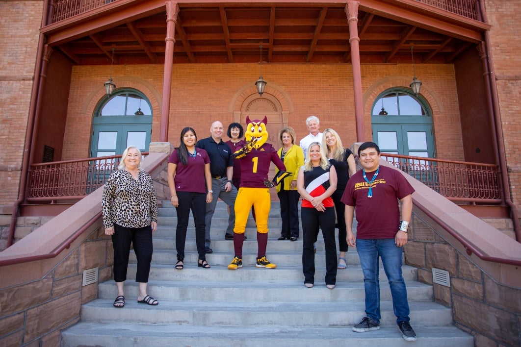 Group of people sitting on ASU Old Main steps