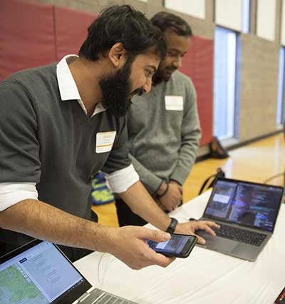 Two men looking at laptop