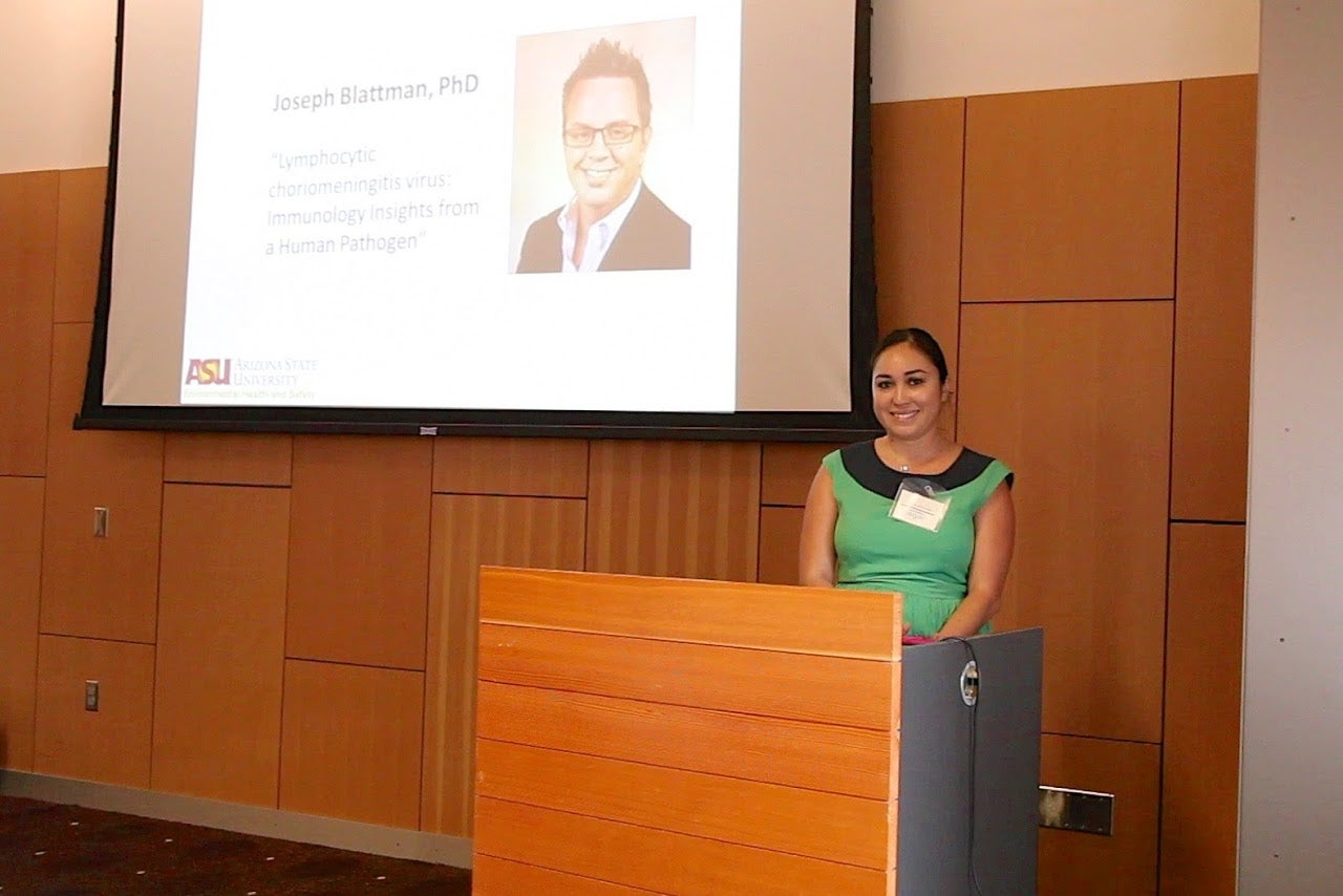 woman standing behind podium