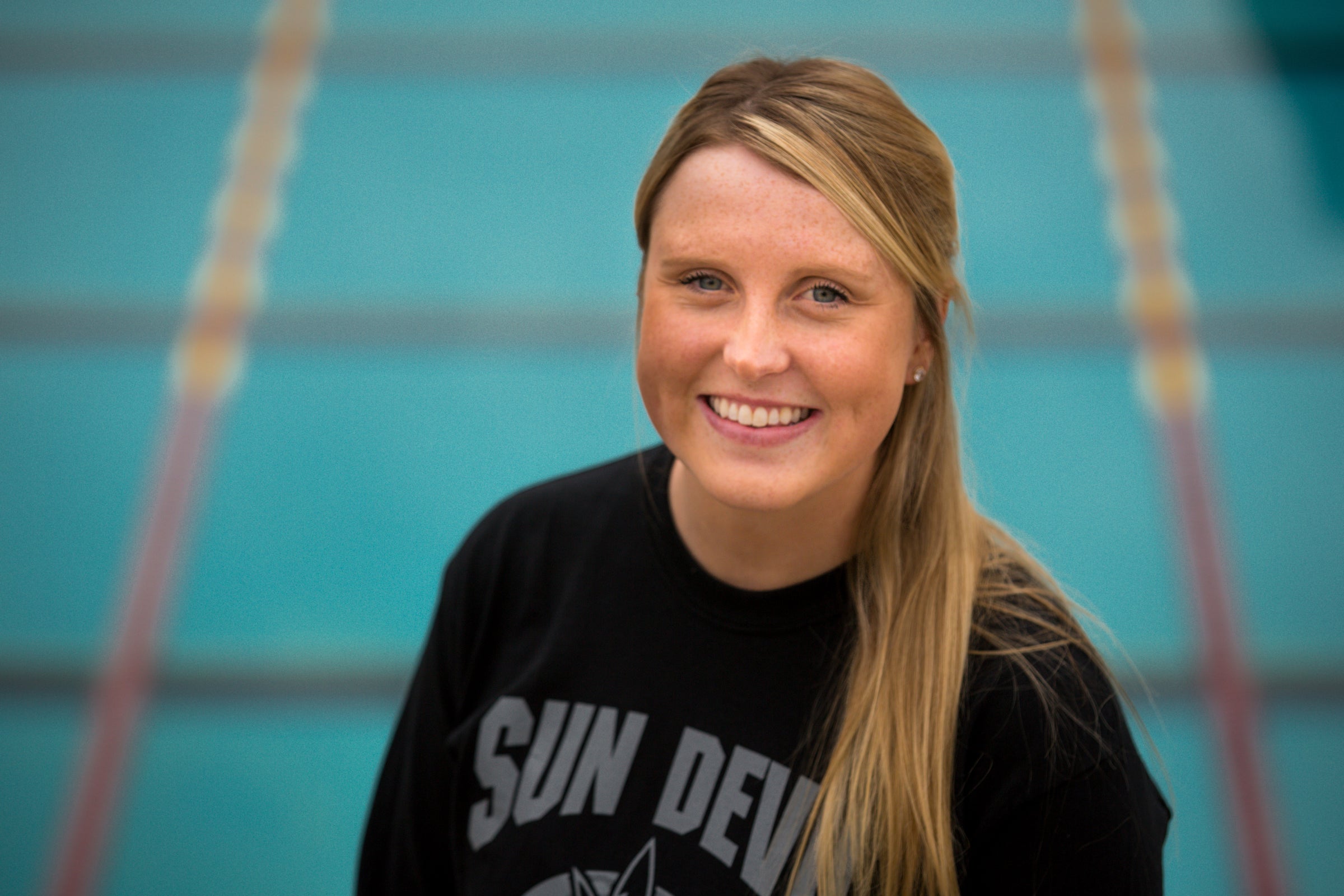 ASU swimmer posing in front of pool