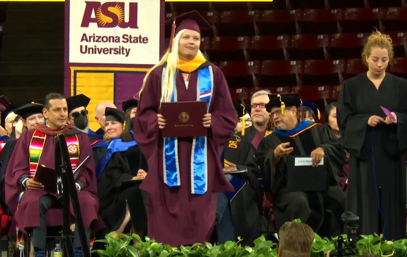 Woman on stage at graduation