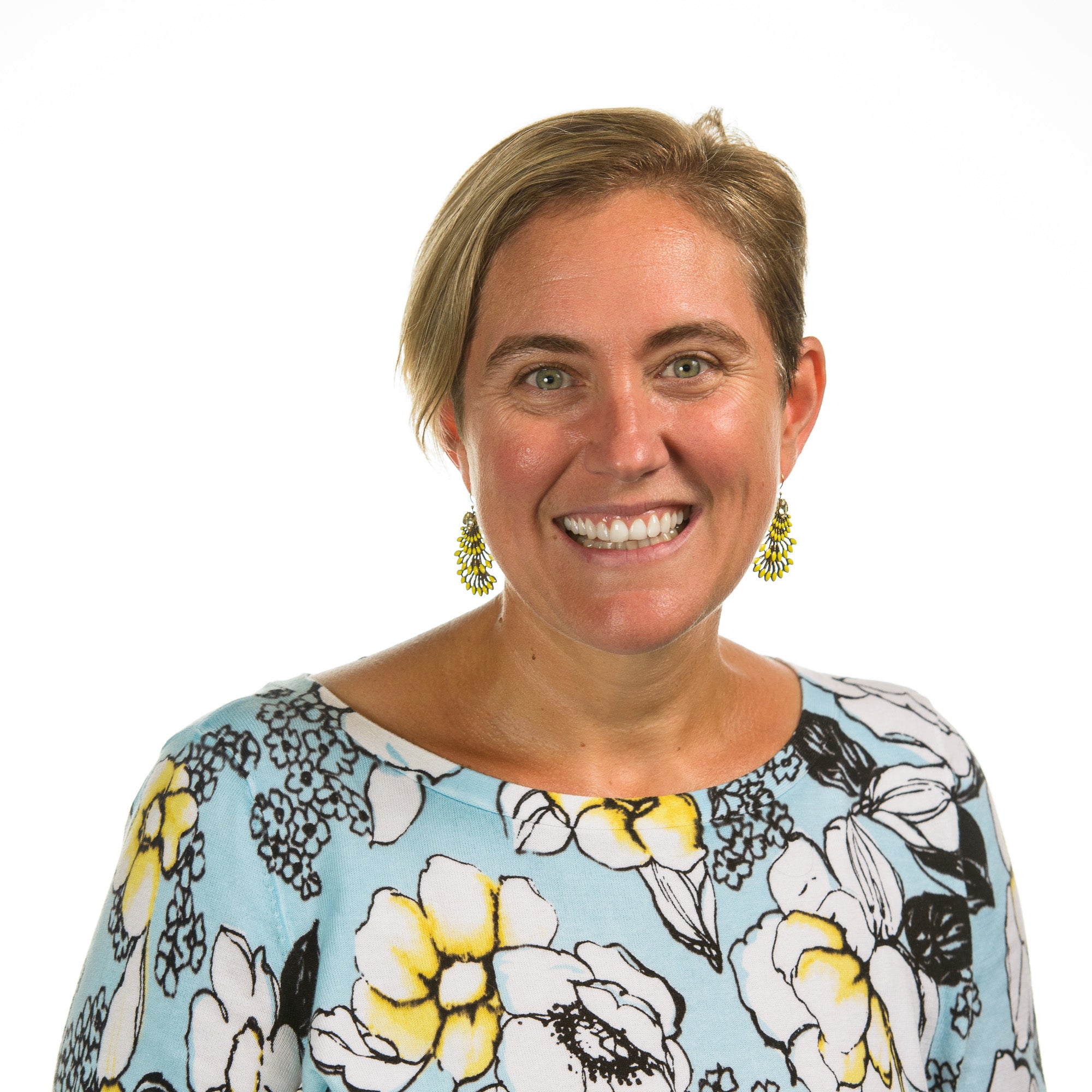 Woman with earrings smiling