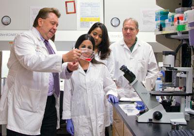 scientists in a lab wearing white coats