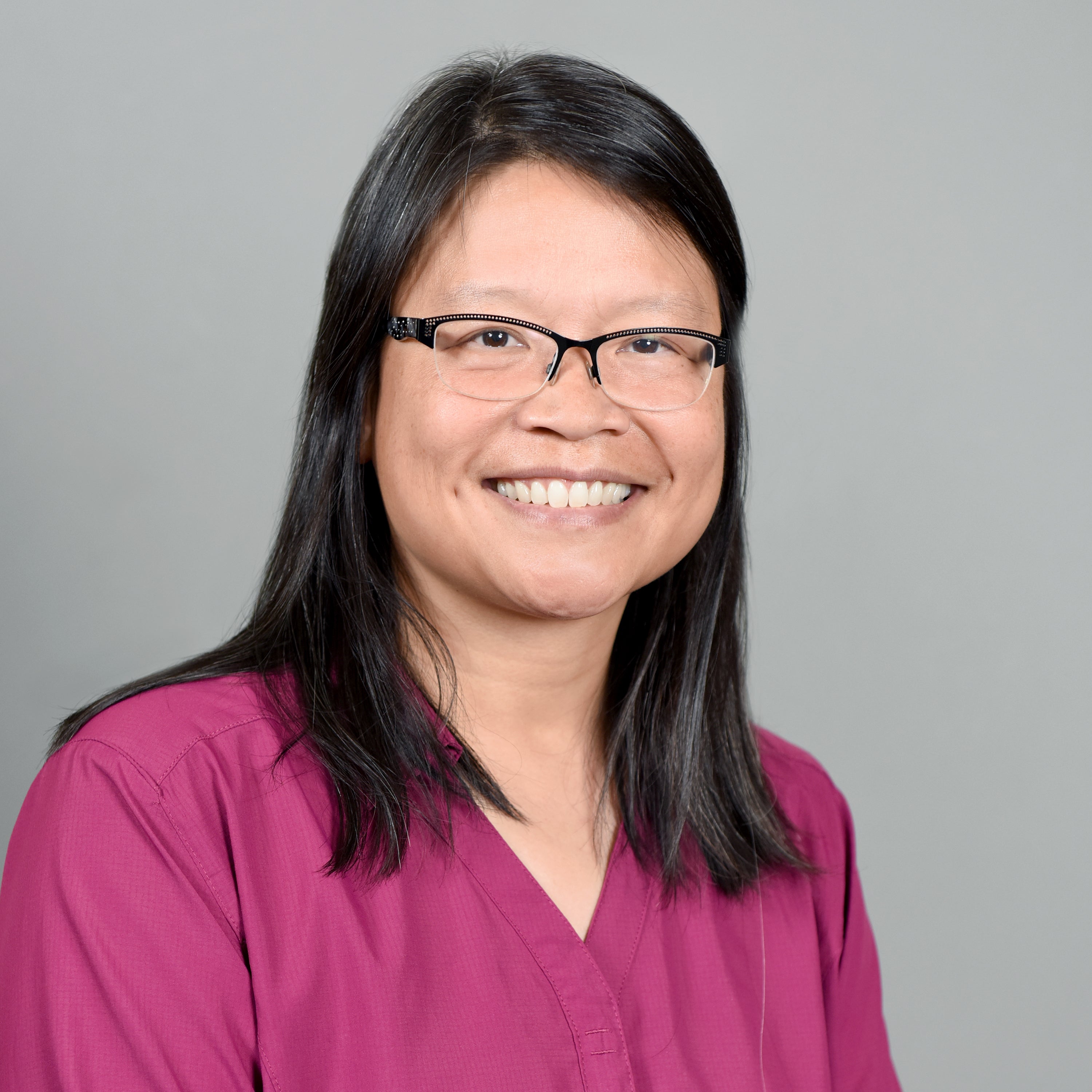 Woman in glasses smiling