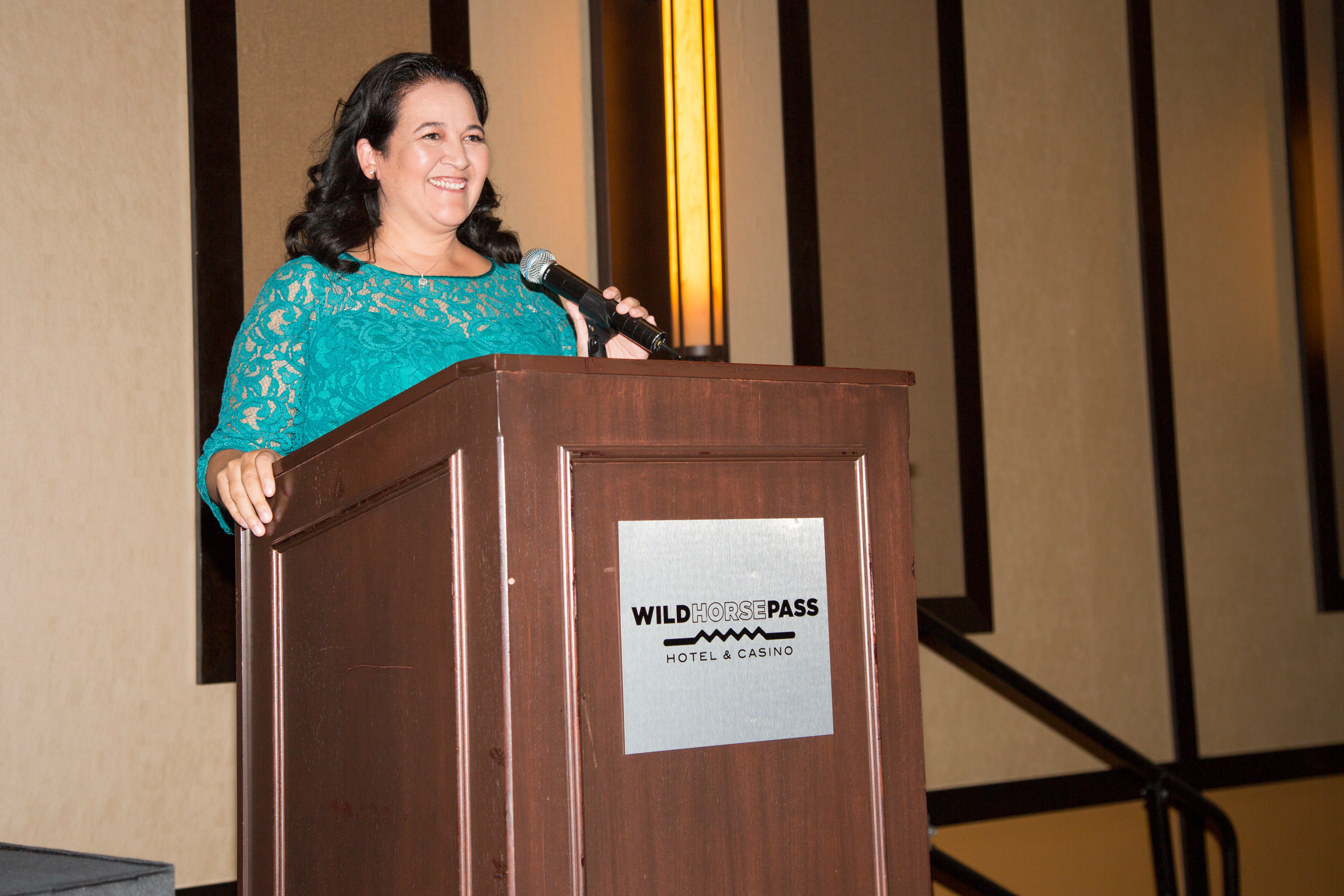 woman speaking at podium