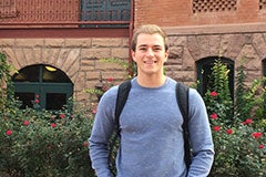 student standing outside of Old Main