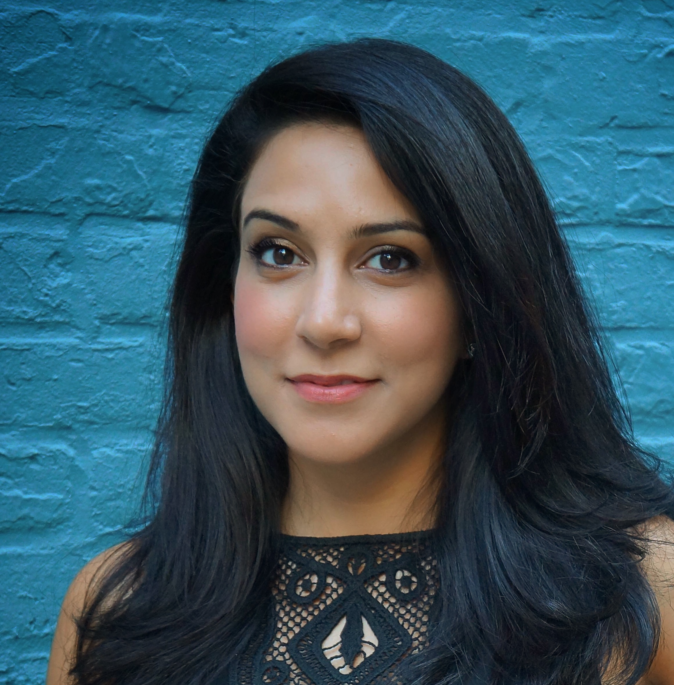 Woman with dark hair and black shirt