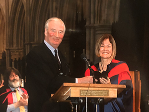 woman receives medal at lectern