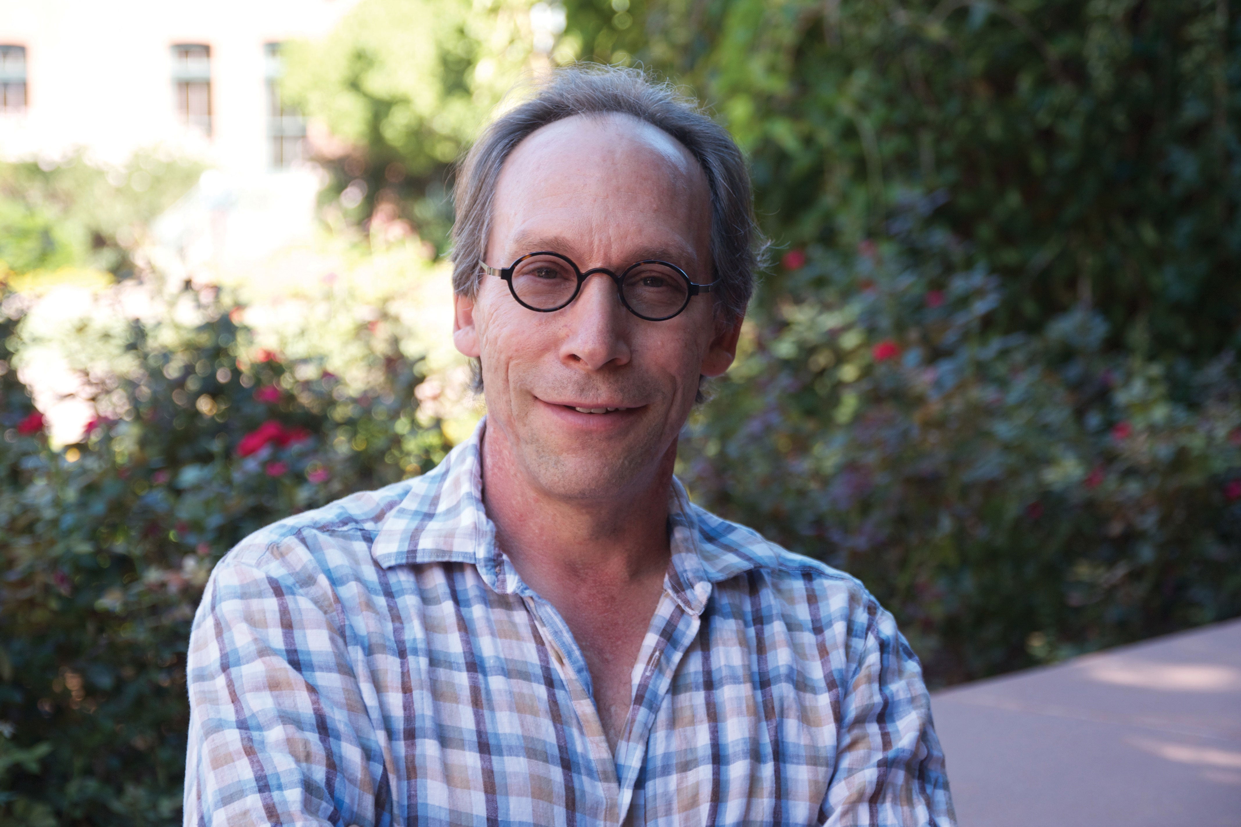 A man poses for a portrait.