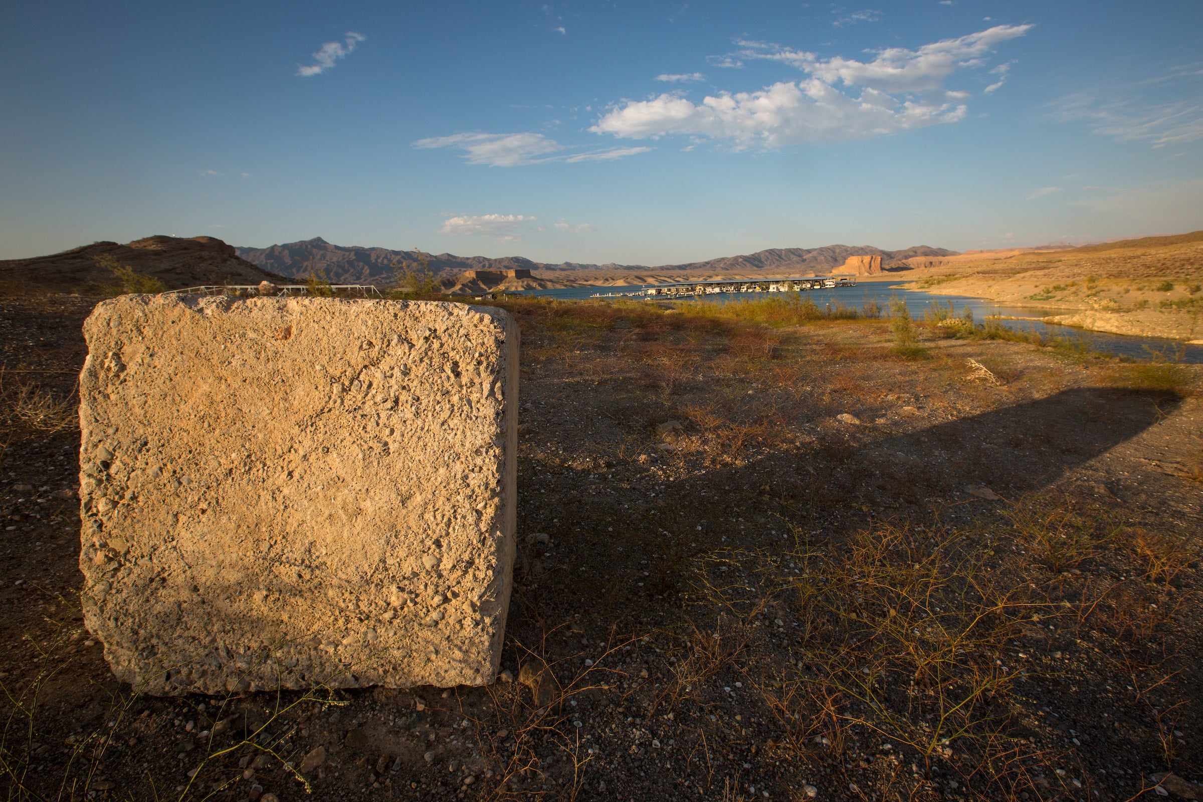 A former dock anchor sits on now-dry land