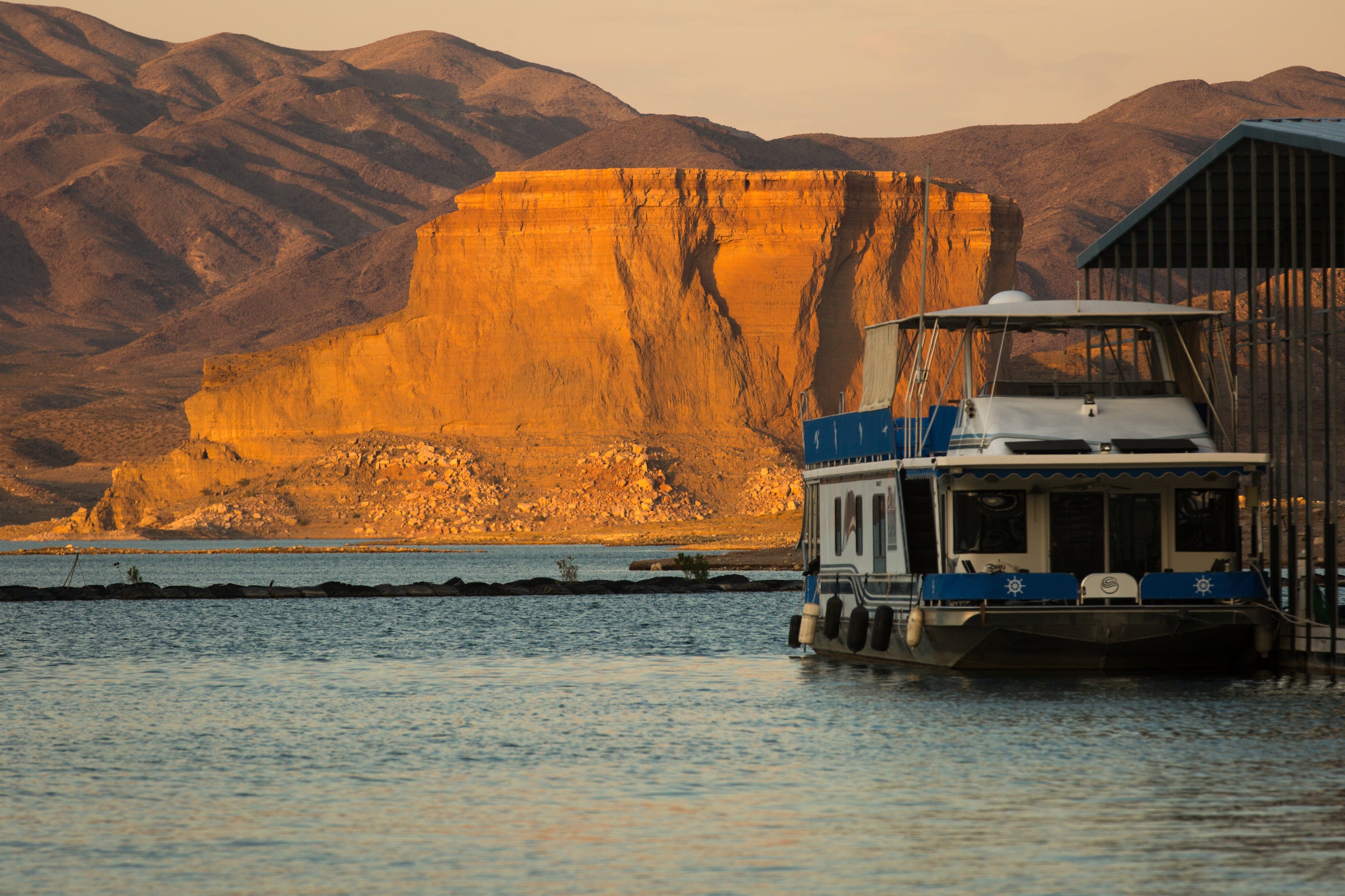 A large boat sits at a marina at Lake Mead