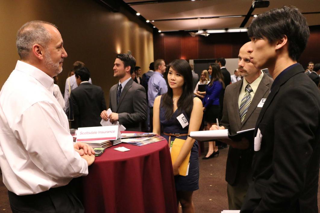 Ken Levine talking with students at Actuarial Science Career Day